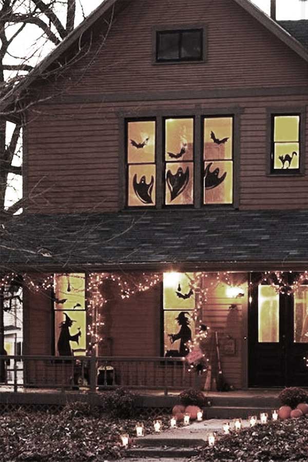 Siluetas en ventanas para la noche de Halloween